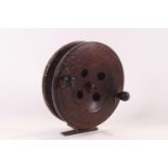 A large vintage 7" wooden fishing reel