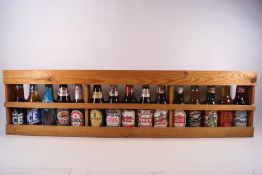 Various bottles of beers and lagers in a display shelf