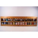 Various bottles of beers and lagers in a display shelf