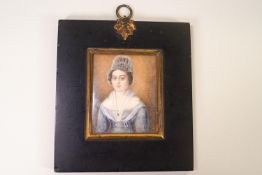 English School, early 19th century, Portrait miniature of a lady, watercolour on ivory,