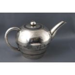 A Middle Eastern niello white metal three piece tea service and sugar tongs,