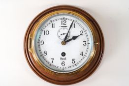A Mercer bulkhead ship's clock, with key, the printed dial with subsidiary second dial,