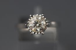 A white metal illusion set single stone diamond ring stated weight of 1.