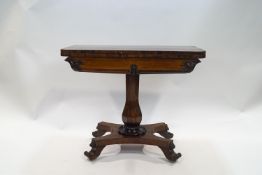 A William IV rosewood card table on a turned and carved column and quatre form base, 72.
