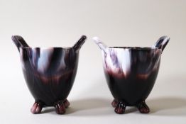 A pair of Selby slag glass two handled pots on four feet,
