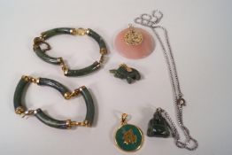 A collection of Chinese hardstone jewellery, comprising of two bangles and four pendants,