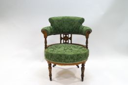 An Edwardian rosewood tub shaped chair with marquetry inlay on turned legs