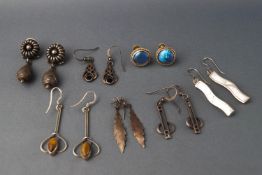 Seven pairs of white metal earrings, some stamped "925",