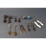 Seven pairs of white metal earrings, some stamped "925",