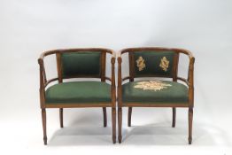A pair of Edwardian rosewood armchairs r tub form on turned legs