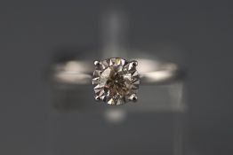 A white metal illusion set single stone diamond ring. Stated weight as 0.27 carats.