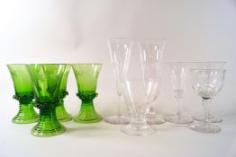 A set of four Continental green wine glasses, engraved with fruiting vines, 12.