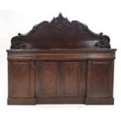 A Victorian mahogany sideboard with raised back above frieze drawers,