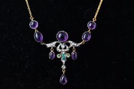 A yellow metal centre piece necklace set with cabochon amethyst, seed pearls and a centre diamond.