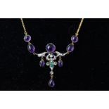 A yellow metal centre piece necklace set with cabochon amethyst, seed pearls and a centre diamond.