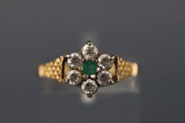A 9ct gold emerald and cubic zirconia cluster ring. Hallmarked 9ct gold, Birmingham. Size: O 1.