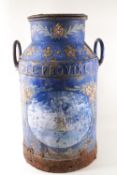 A painted milk churn, with a ship at sea within a roundel on a blue ground with flowers,