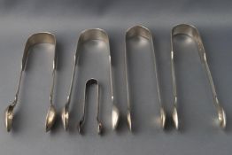 Five pairs of silver sugar tongs in various sizes, early 19th century and later,