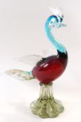 A Murano style glass figure of a bird with gold inclusions to the tail on flared base, 28.