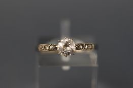 A white metal single stone old cut diamond ring approx 0.50ct with old rose cut shoulders.