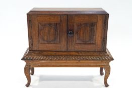 A rosewood table cabinet on stand 39cm high x 45cm wide x 16cm depth