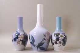 A pair of Royal Copenhagen tall necked vases, decorated with blackberries,