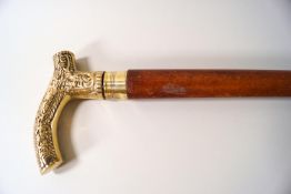 A malacca shafted brass handled walking stick