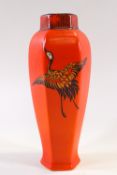 A Shelley porcelain six sided vase with three printed and painted cranes on a red ground,