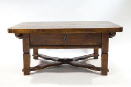 A continental elm coffee table, of rectangular form with the top linked by X stretchers,