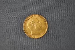 A 22ct yellow gold half sovereign coin, dated 1906 4.