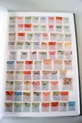 A stockbook full of Hong Kong and Falkland Island stamps plus some Jersey and Guernsey ones,