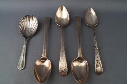 A set of three silver tea spoons with bright cut decoration,