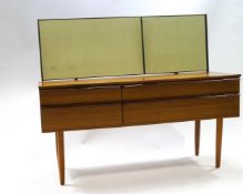 A 1970's mirror back dressing table with four drawers,