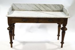 A Victorian mahogany wash stand with white marble top over two drawers on turned legs,
