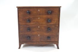 A George III mahogany commode with four faux drawers with later turned handles,