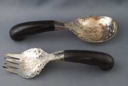 A pair of Indian white metal salad servers, with horn handles, 23 cm long,