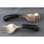 A pair of Indian white metal salad servers, with horn handles, 23 cm long,