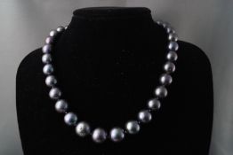 A set of graduated freshwater cultured black pearls measuring from 11.50mm to 14.