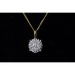 A yellow and white metal diamond cluster pendant set with eleven round brilliant cut diamonds.