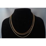 A 9ct gold chain and two silver gilt necklaces. Gross weight: 6.