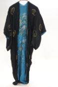 A Japanese reversible Kimono on one side embroidered with gold coloured threads with a dragon on a