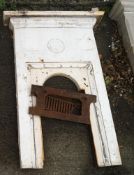 A Victorian painted cast iron fireplace and grate with Tudor Rose detail,