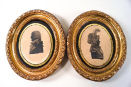 A pair of late 18th/early 19th century silhouettes, pen and ink in gilt metal frames, 11cm x 8cm,