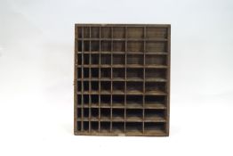 A Stephenson Blake & Co pigeon hole comprising fifty six graduated compartments,