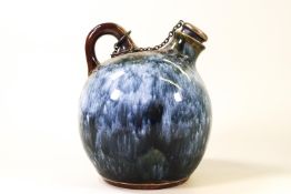 A Doulton stone jug of globular form with ring handle, and silver mounted cork stopper,