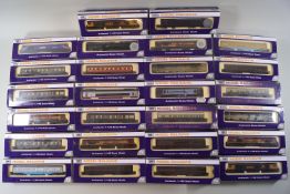 A collection of twenty-six Dapol 'N' gauge railway coaches and wagons and frieghtliners,
