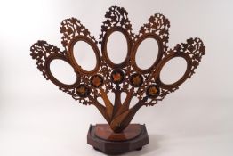 A 19th century Sorento-ware olive wood fan picture holder with pierced marquetry and pen work