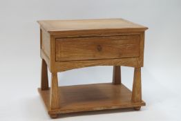 A modern teak side table with drawer and undershelf,