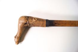 A walking stick with carved limestone handle in the form of an otter
