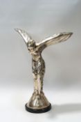 A cast metal figure of the Spirit of Ecstasy, on a marble base,